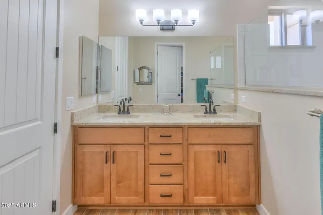 a bathroom with a sink and a mirror
