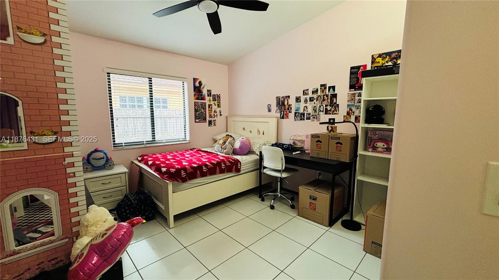 16605 Southwest 90th Street Miami, FL 33196 - Photo 17 of 35 a bedroom with a bed and a window