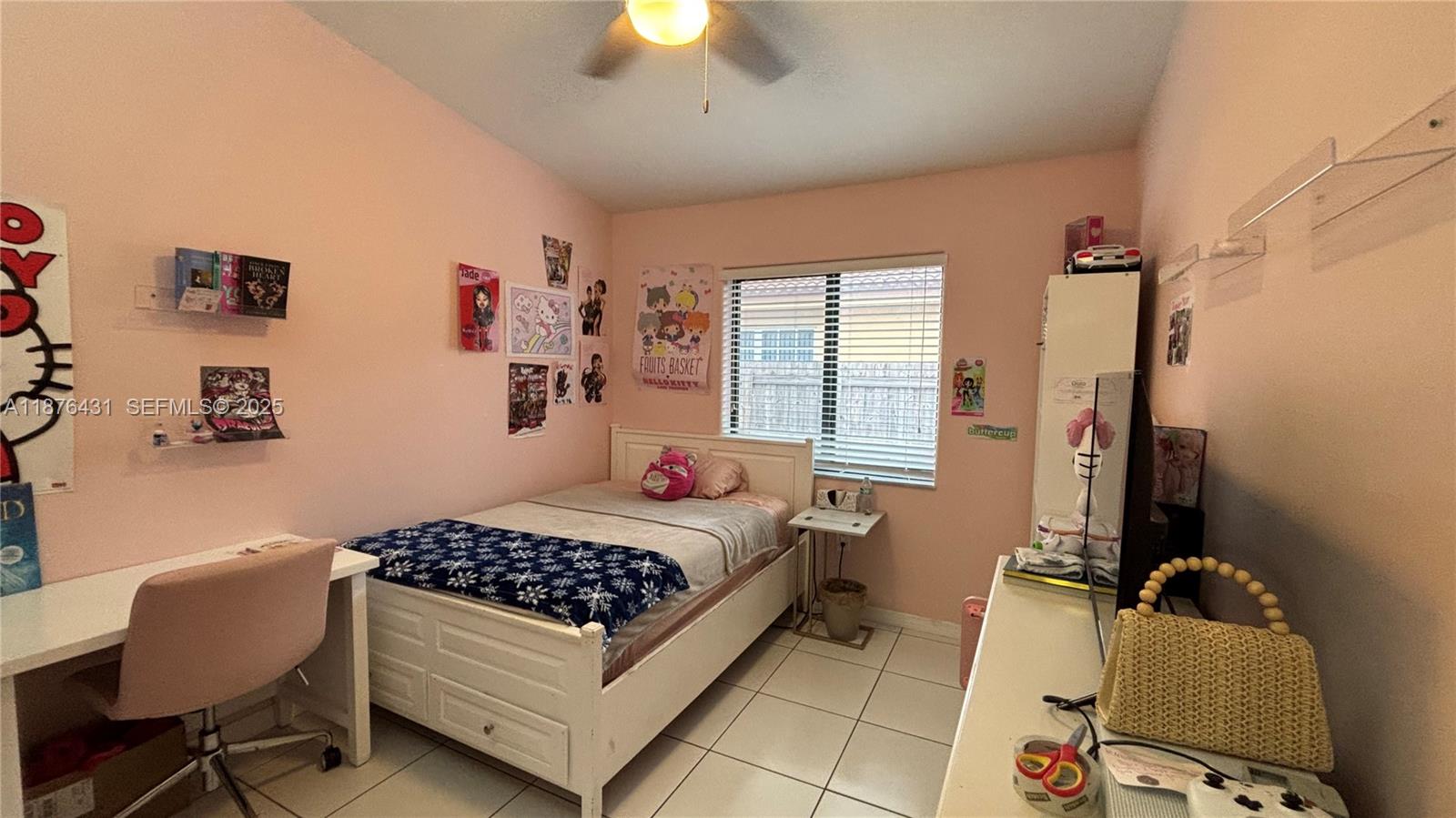 16605 Southwest 90th Street Miami, FL 33196 - Photo 18 of 35 a bedroom with a bed and a window