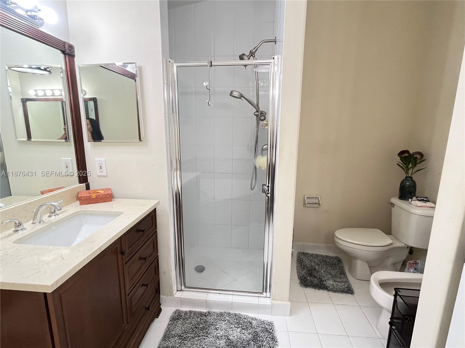 16605 Southwest 90th Street Miami, FL 33196 - Photo 28 of 35 a bathroom with a sink toilet and shower