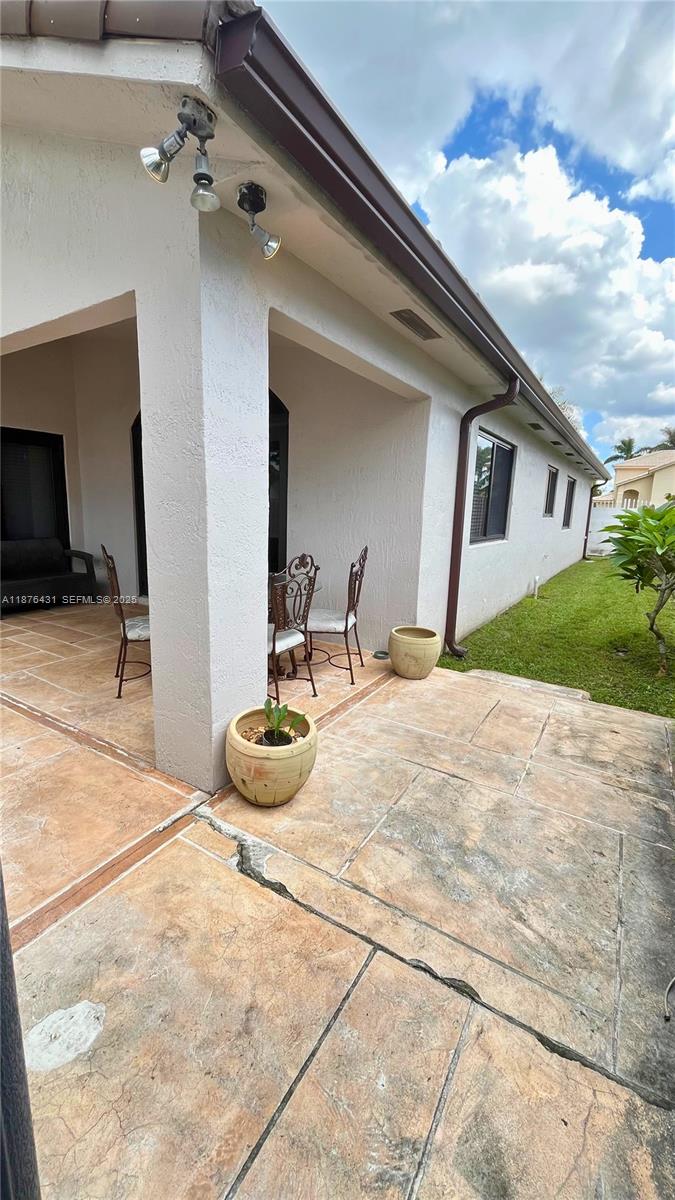 16605 Southwest 90th Street Miami, FL 33196 - Photo 30 of 35 a bathroom with a sink and a mirror