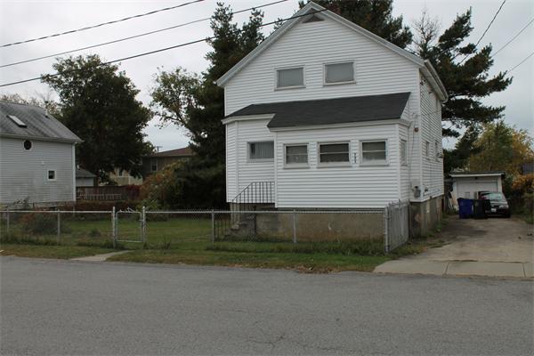 121 Garfield Street Fall River, MA 02721 - Photo 3 of 3 a front view of a house with a yard
