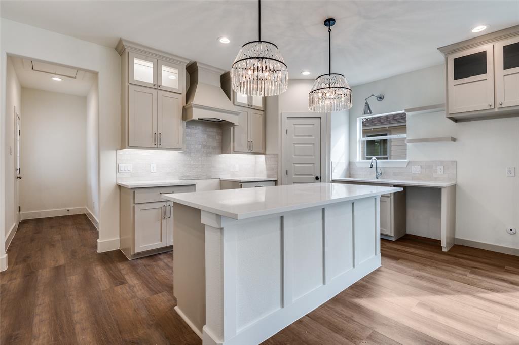 3608 Latimer Street Dallas, TX 75215 - Photo 2 of 15 a very nice looking kitchen with granite countertop a stove oven and a wooden floor