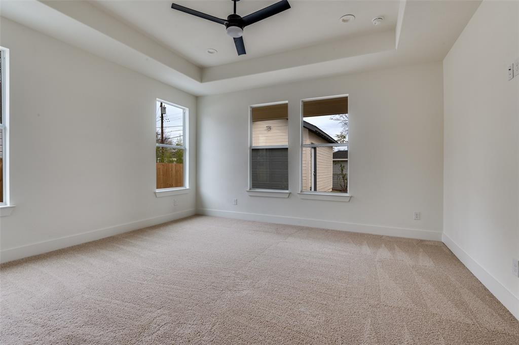 3608 Latimer Street Dallas, TX 75215 - Photo 4 of 15 en empty room with windows and ceiling fan