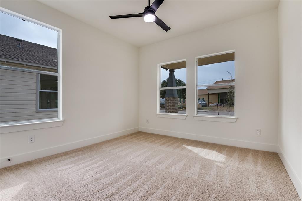 3608 Latimer Street Dallas, TX 75215 - Photo 10 of 15 a view of empty room with wooden floor and fan