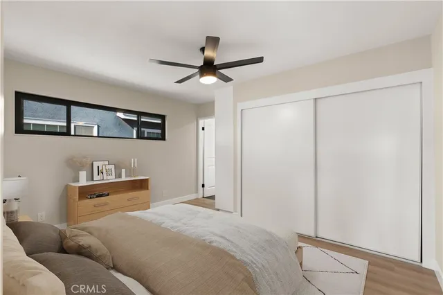 a bedroom with a bed and cabinets