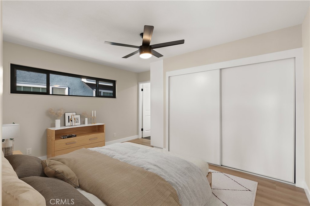 13562 Springdale Street Westminster, CA 92683 - Photo 20 of 34 a bedroom with a bed and cabinets