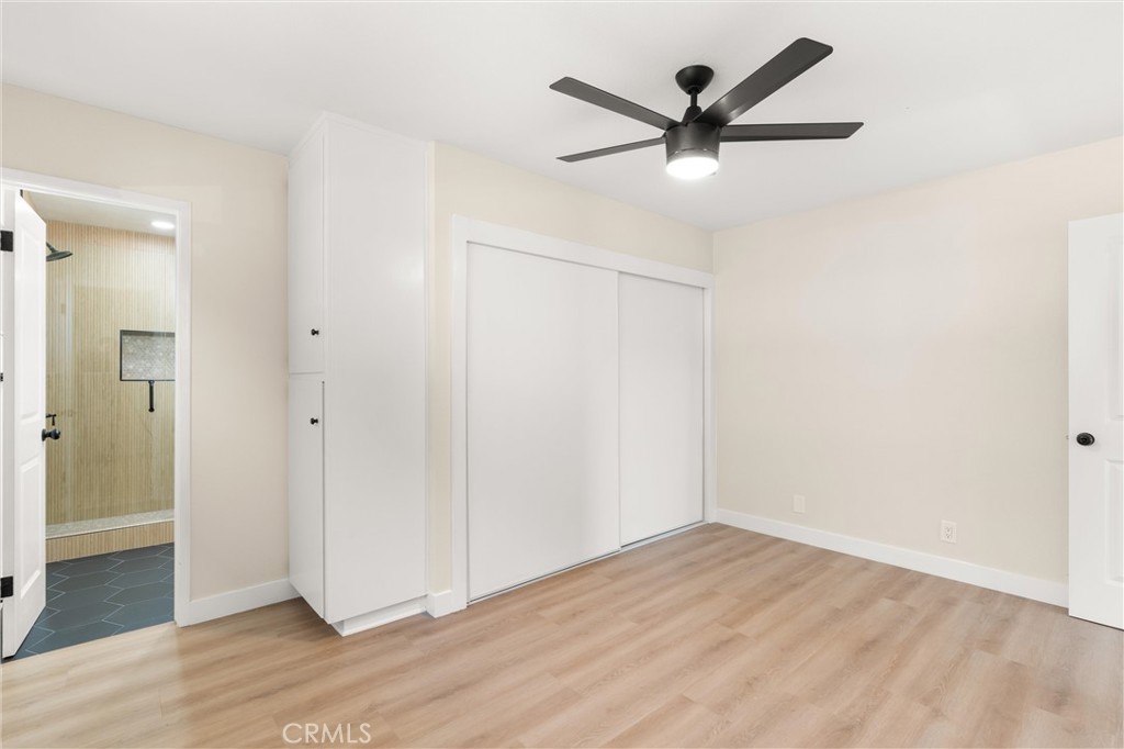 13562 Springdale Street Westminster, CA 92683 - Photo 22 of 34 an empty room to hallway with wooden floor
