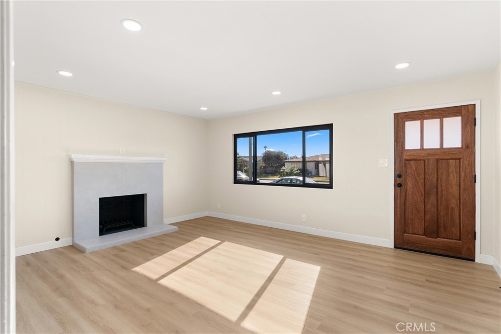 13562 Springdale Street Westminster, CA 92683 - Photo 7 of 34 a view of an empty room with glass door and a window