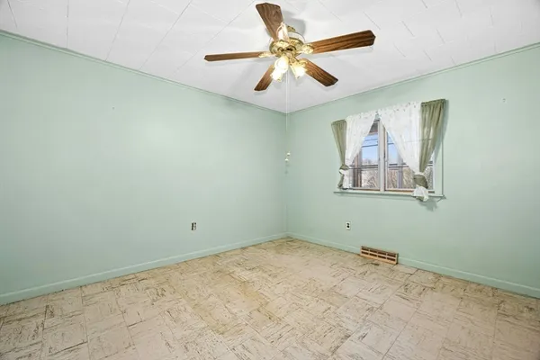 a view of room with window and ceiling fan