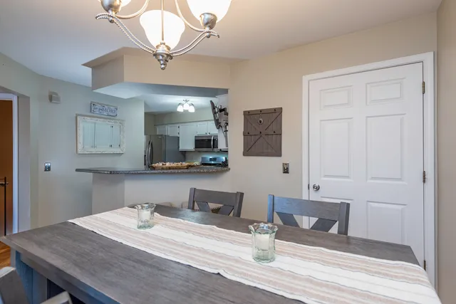 a view of a kitchen from the hallway