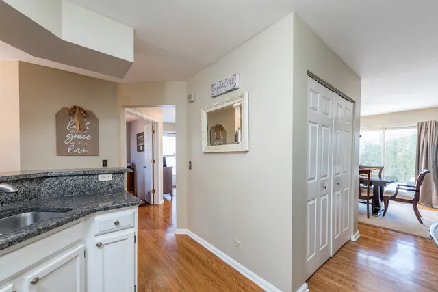 a spacious bathroom with a granite countertop sink and a mirror