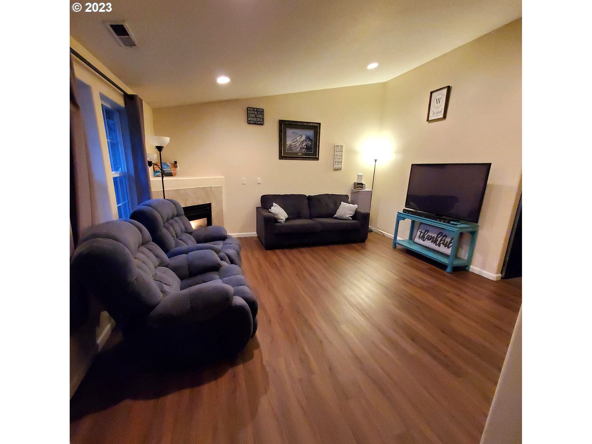 1399 North Shepherd Road Washougal, WA 98671 - Photo 7 of 32 a living room with furniture and a flat screen tv