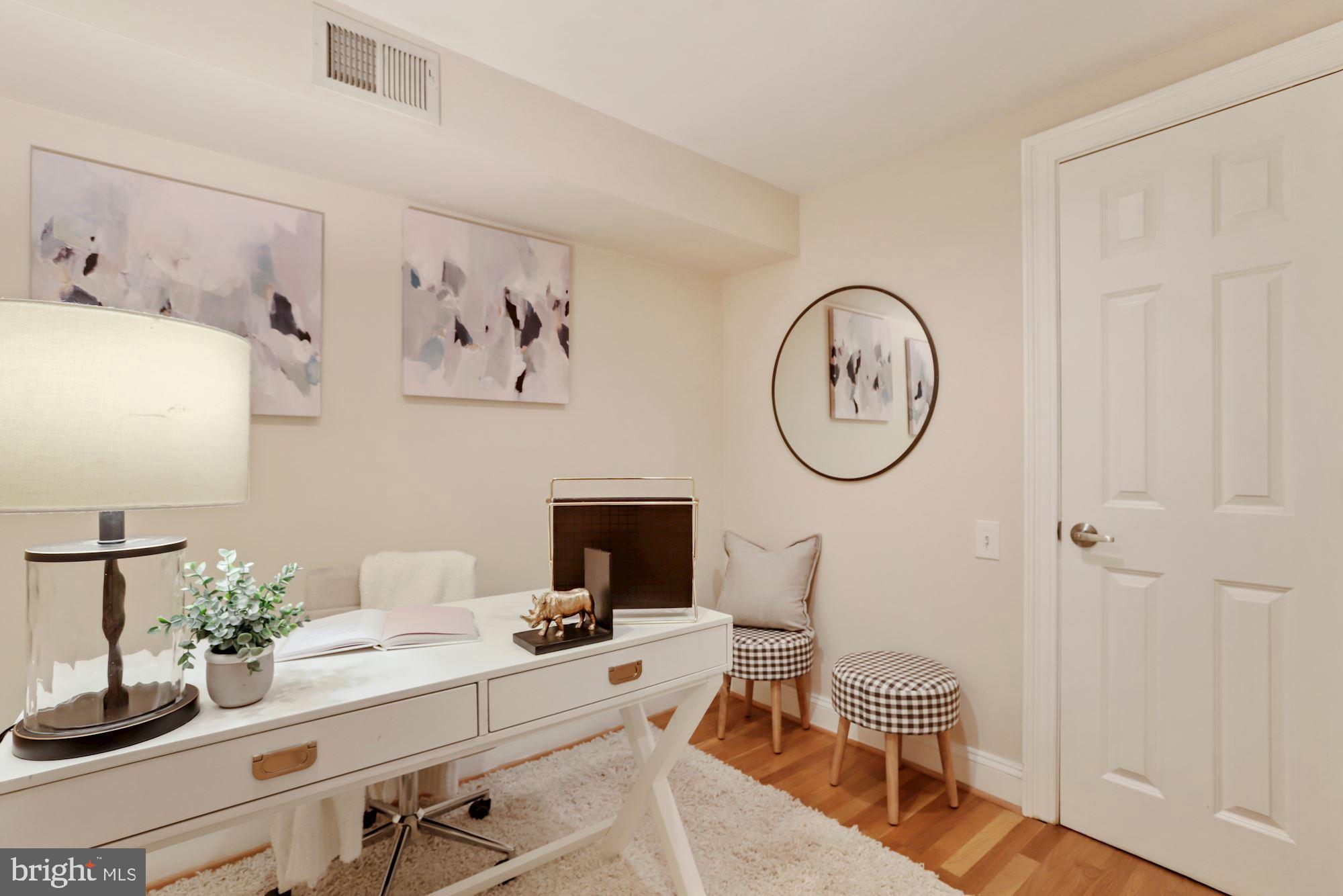 1713 18th Street Northwest, Unit B Washington, DC 20009 - Photo 19 of 23 a room with a table chairs and a mirror