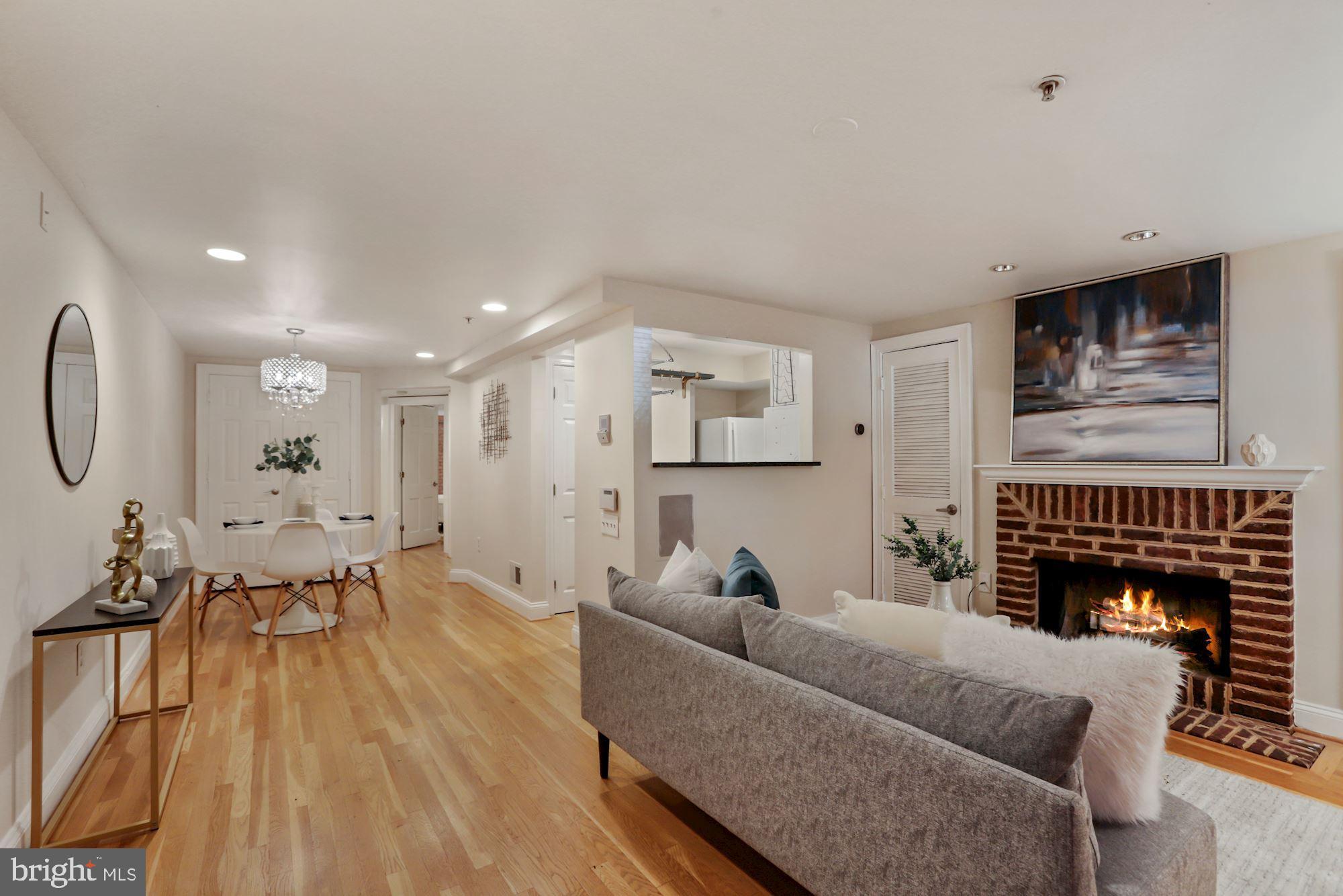 1713 18th Street Northwest, Unit B Washington, DC 20009 - Photo 3 of 23 a living room with furniture and a fireplace