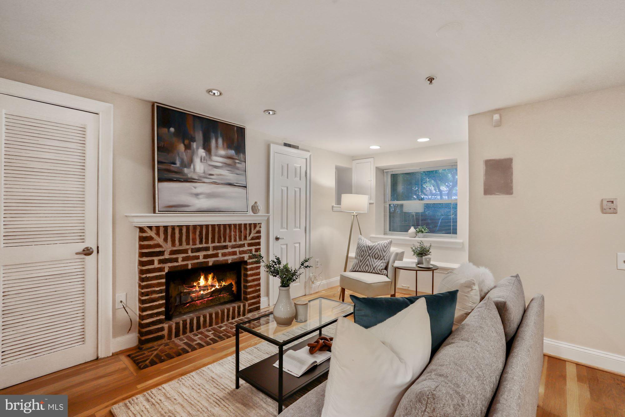 1713 18th Street Northwest, Unit B Washington, DC 20009 - Photo 4 of 23 a living room with furniture and a fireplace
