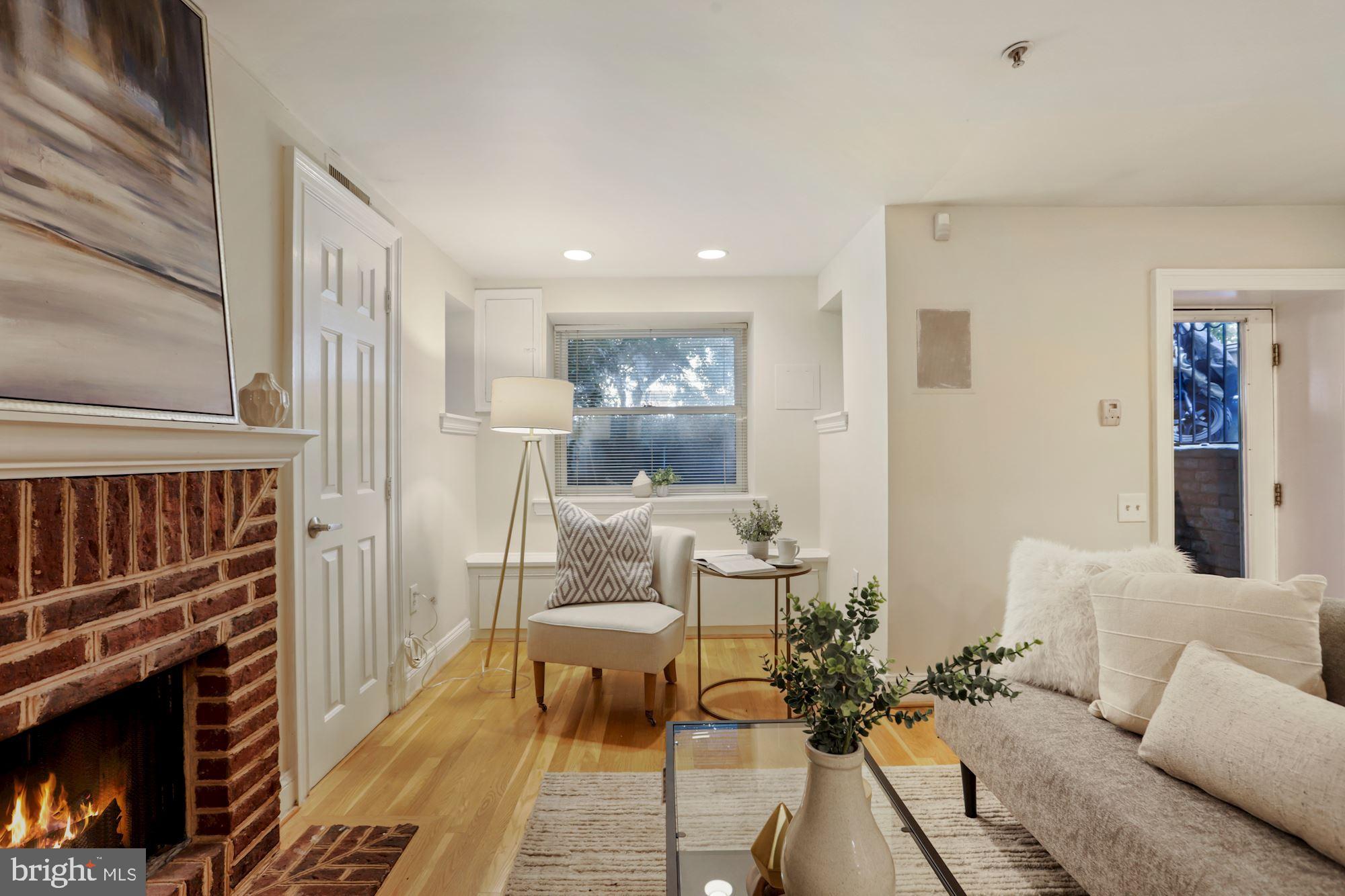 1713 18th Street Northwest, Unit B Washington, DC 20009 - Photo 5 of 23 a living room with furniture and a fireplace