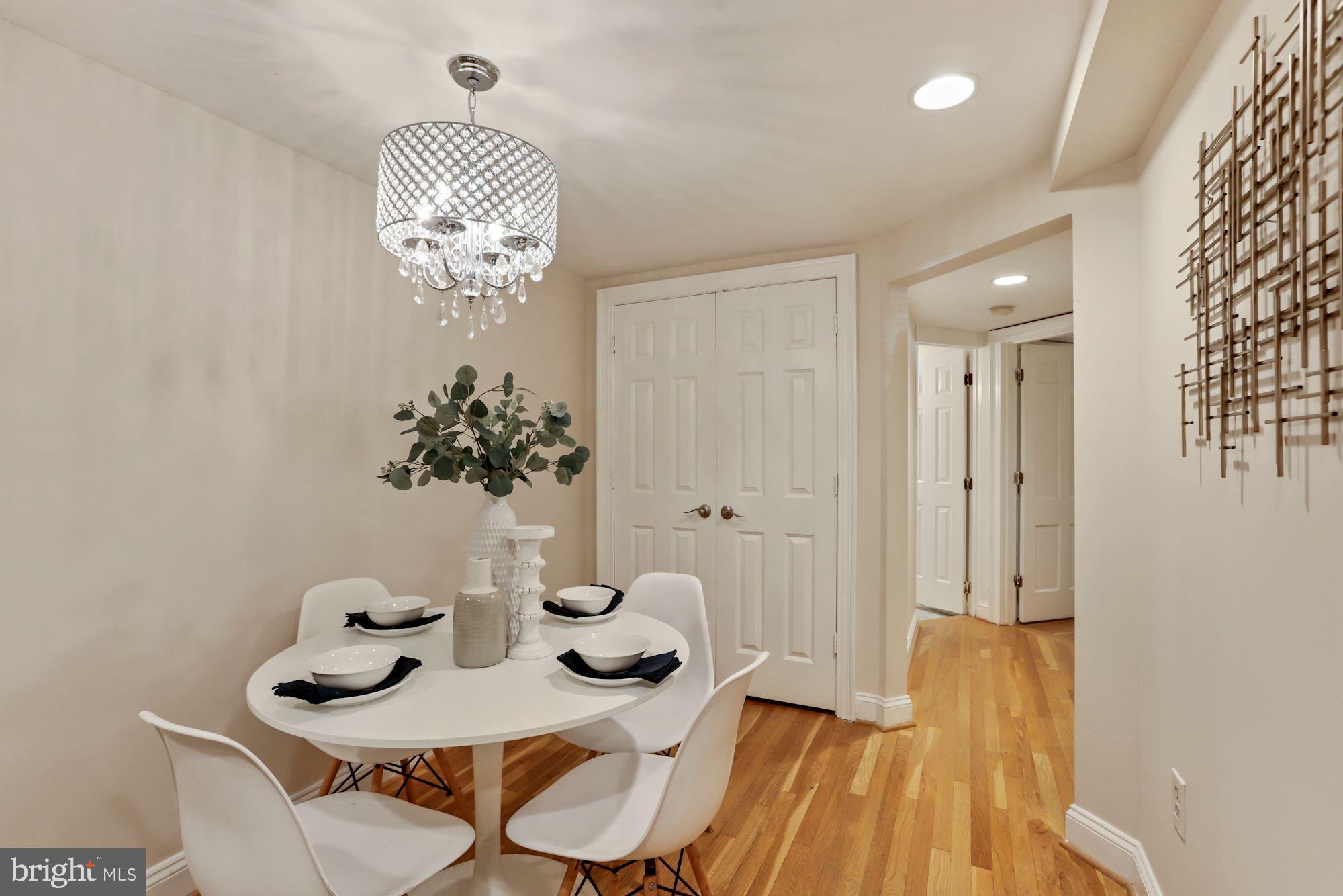 1713 18th Street Northwest, Unit B Washington, DC 20009 - Photo 9 of 23 a view of a dining room with furniture and chandelier
