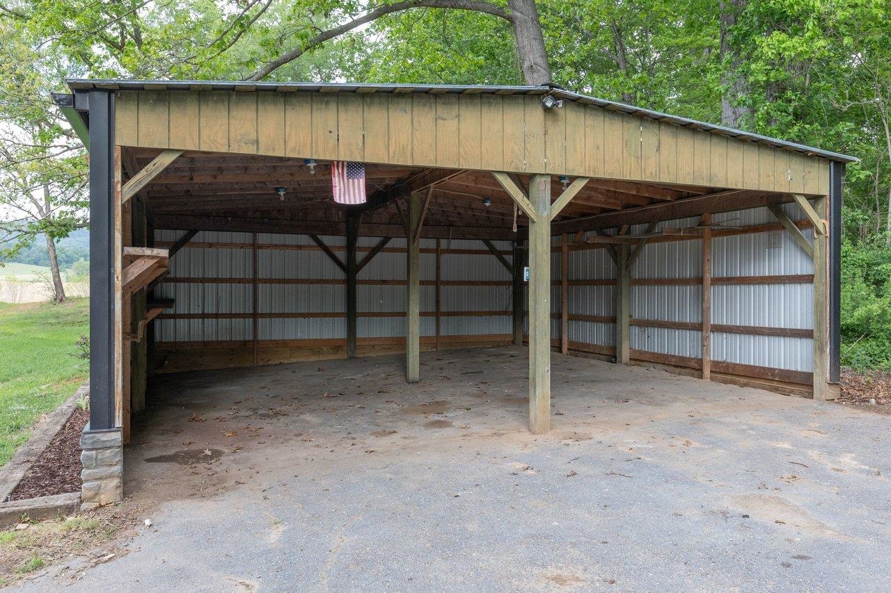 547 Grindstone Road Bridgewater, VA 22812 - Photo 48 of 57 a backyard of a house with barbeque oven and outdoor seating