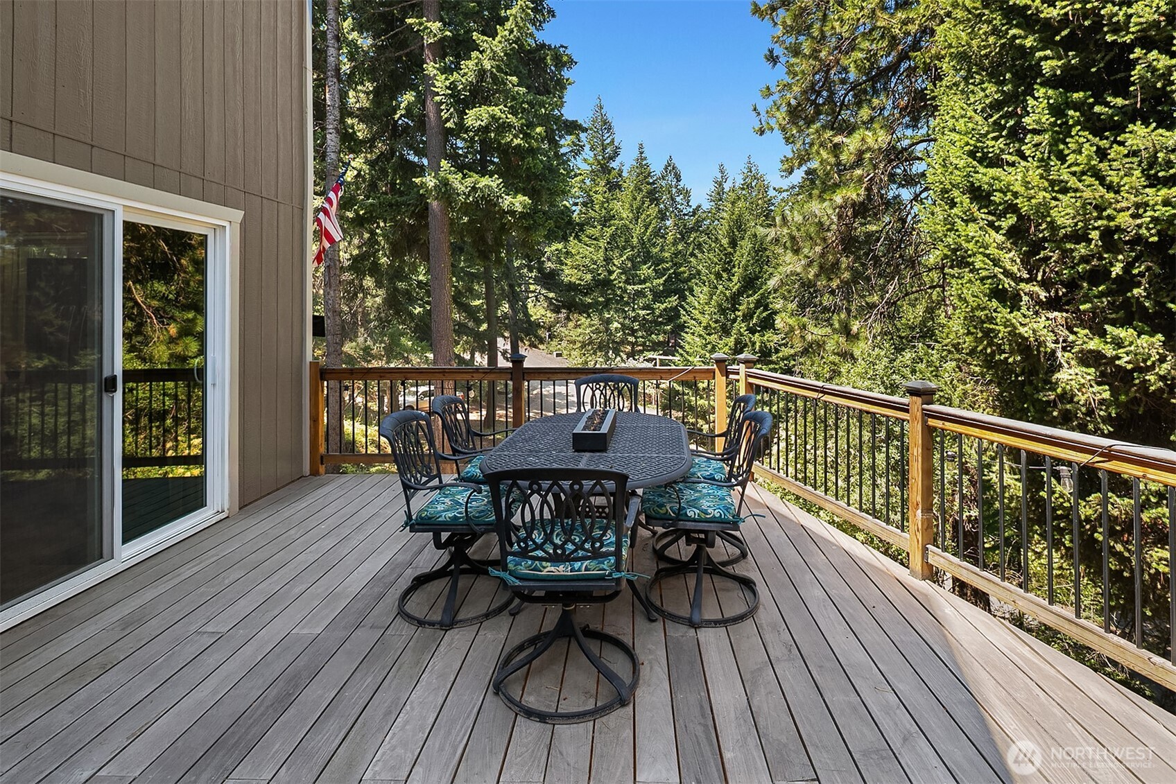 61 Tom And Nita Road Cle Elum, WA 98922 - Photo 18 of 27 a view of a deck with table and chairs and wooden floor