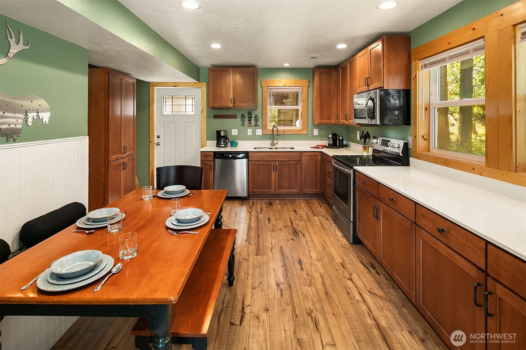 61 Tom And Nita Road Cle Elum, WA 98922 - Photo 6 of 27 an open kitchen with kitchen island wooden floor and stainless steel appliances