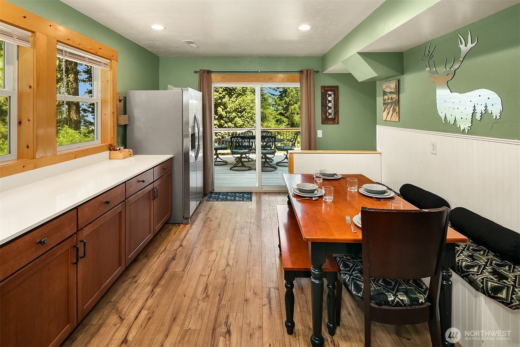 61 Tom And Nita Road Cle Elum, WA 98922 - Photo 7 of 27 a living room with a large window wooden floor and furniture