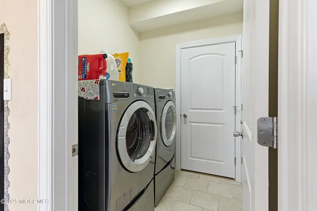 a view of backyard of the house with outdoor seating