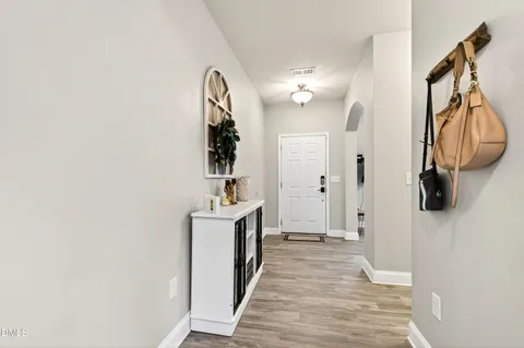 a view of a bathroom from a hallway