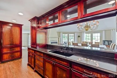 a kitchen with stainless steel appliances a sink and cabinets