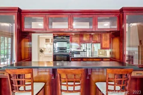 a picture of a red brick building with large windows