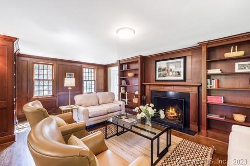 45 Calhoun Street Washington, CT 06794 - Photo 15 of 29 a living room with furniture a fireplace and a large window