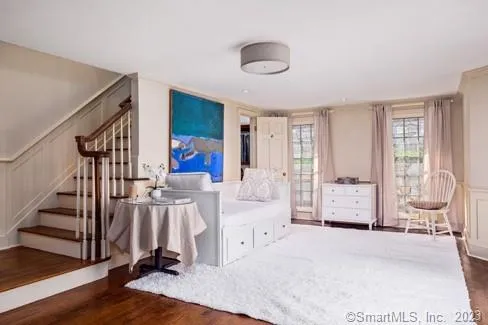 a bedroom with furniture and windows