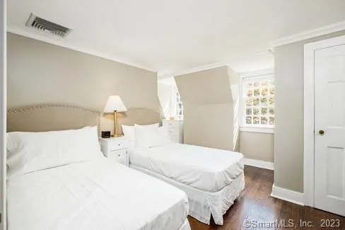 a large white bed in a white room