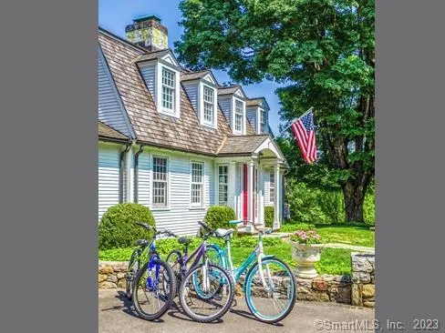 a front view of house with a yard and a table