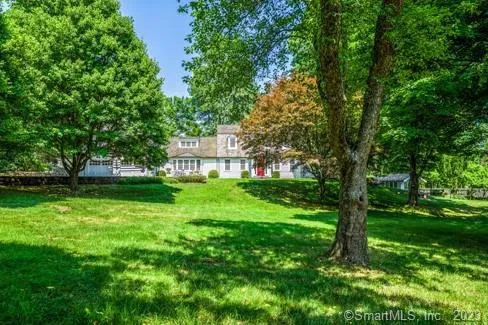 a view of a house with a big yard