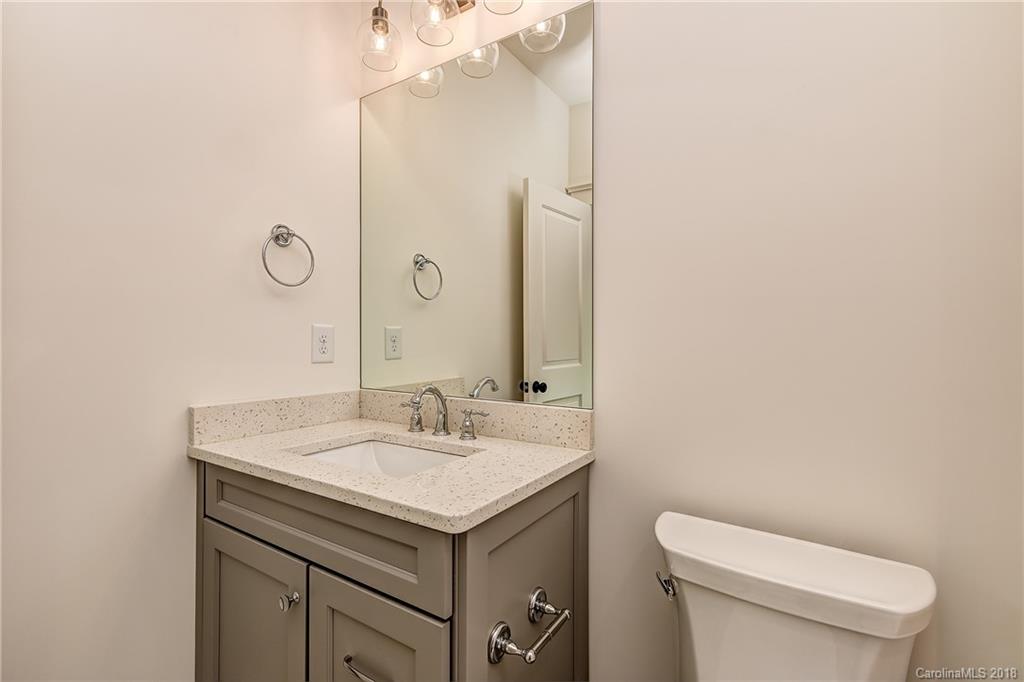 748 Ellsworth Road, Unit 47 Charlotte, NC 28211 - Photo 18 of 34 a bathroom with a sink toilet and mirror