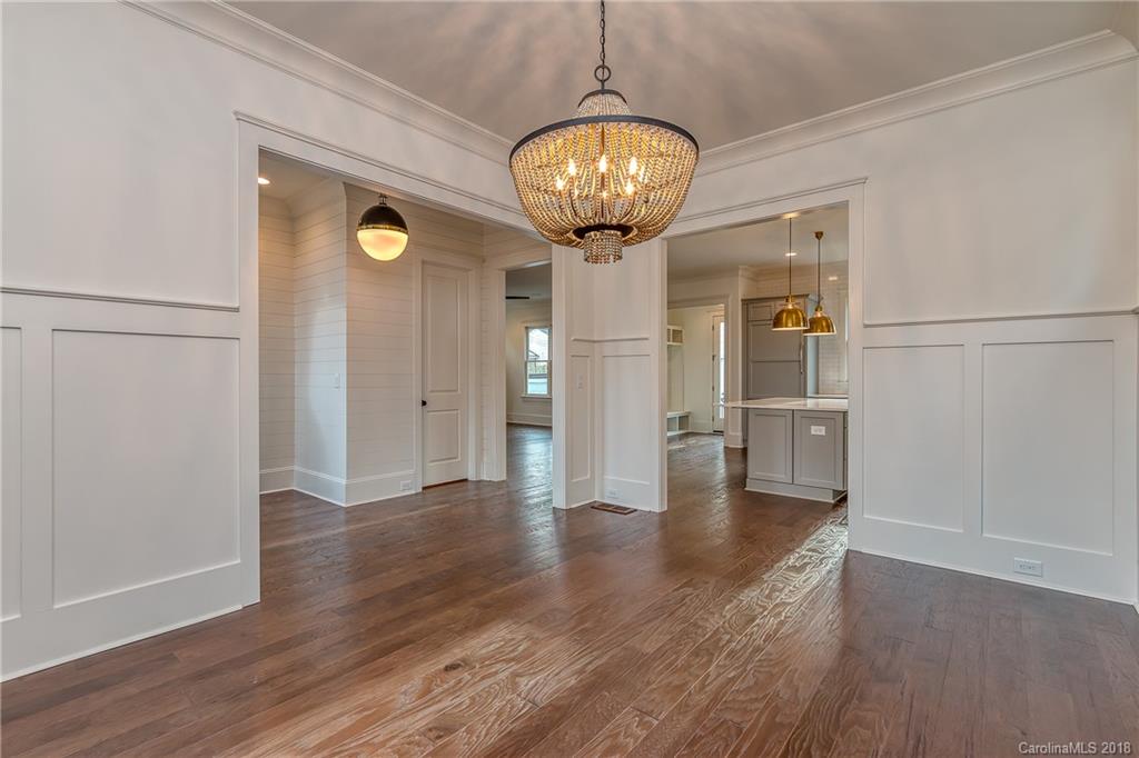 748 Ellsworth Road, Unit 47 Charlotte, NC 28211 - Photo 5 of 34 a view of a hallway with wooden floor