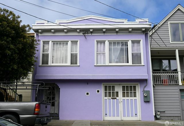 a front view of a house with a garage