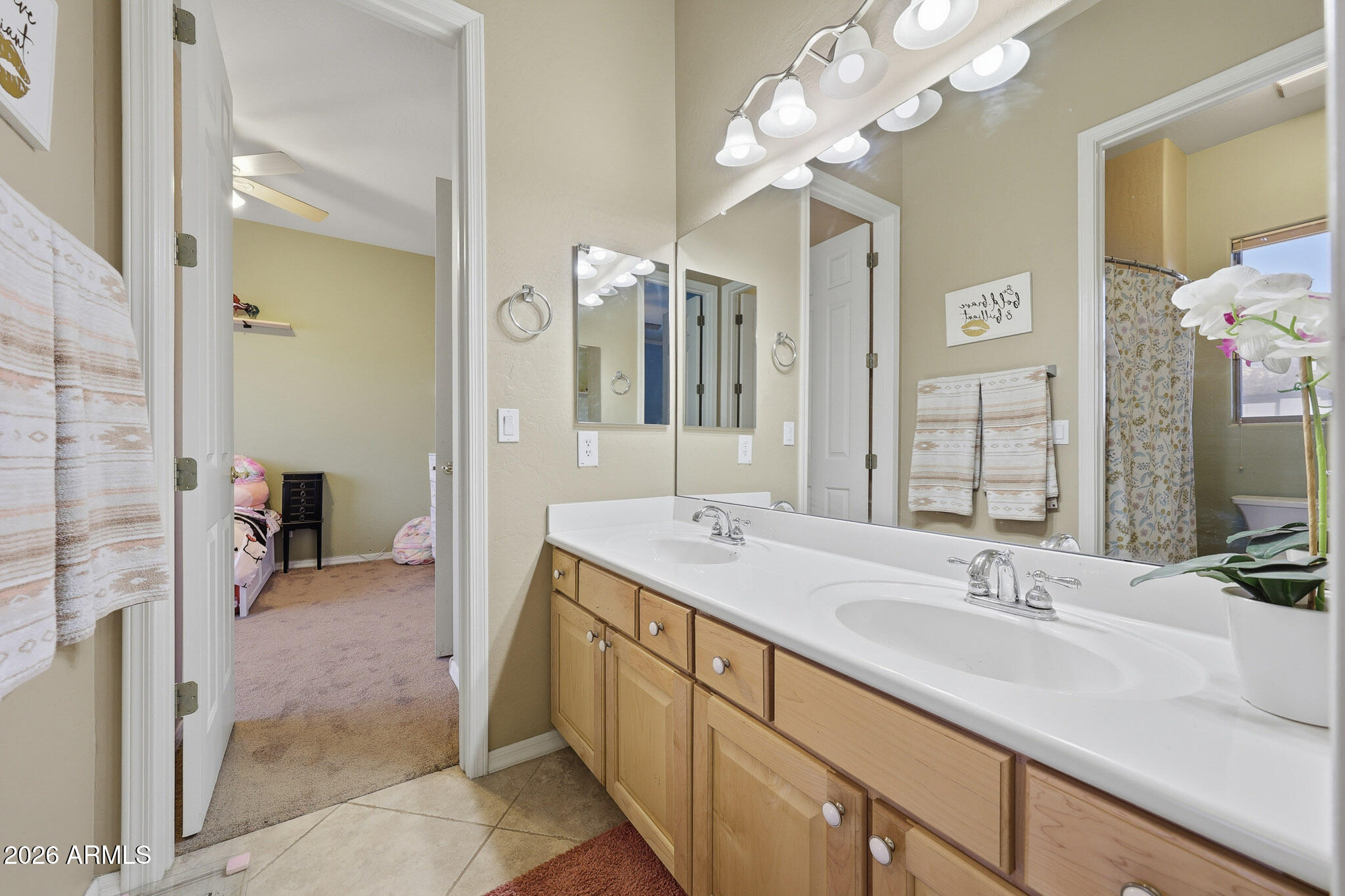 23024 West Sierra Ridge Way Wittmann, AZ 85361 - Photo 14 of 99 a spacious bathroom with a sink double vanity granite and a mirror