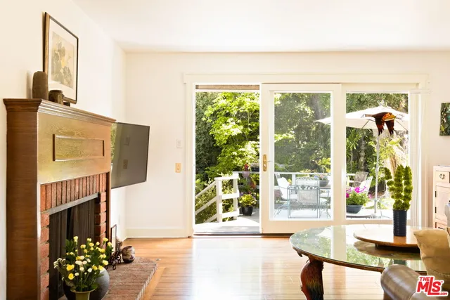 a living room filled with furniture and a fireplace