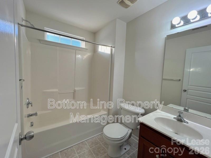 9737 Tidal Court Huntersville, NC 28078 - Photo 15 of 21 a bathroom with a granite countertop sink toilet and shower