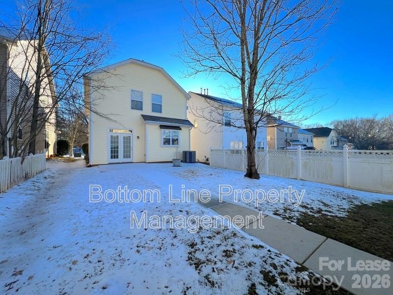 9737 Tidal Court Huntersville, NC 28078 - Photo 16 of 21 a view of a house with a yard covered in snow