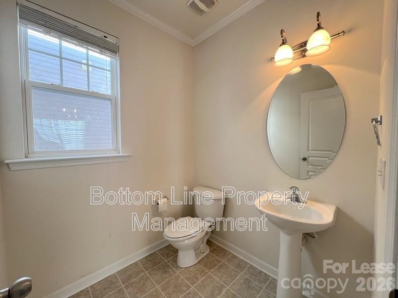 9737 Tidal Court Huntersville, NC 28078 - Photo 5 of 21 a bathroom with a toilet sink and mirror