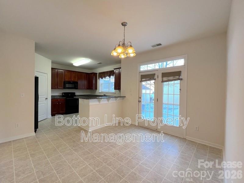 9737 Tidal Court Huntersville, NC 28078 - Photo 6 of 21 a view of a kitchen with a sink and cabinets