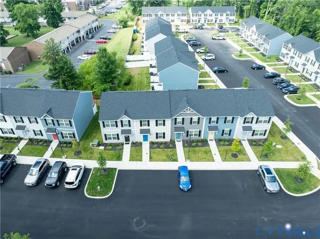 an aerial view of a house with swimming pool
