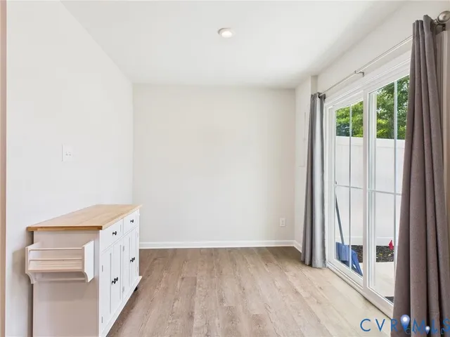 a kitchen with granite countertop a refrigerator and a sink