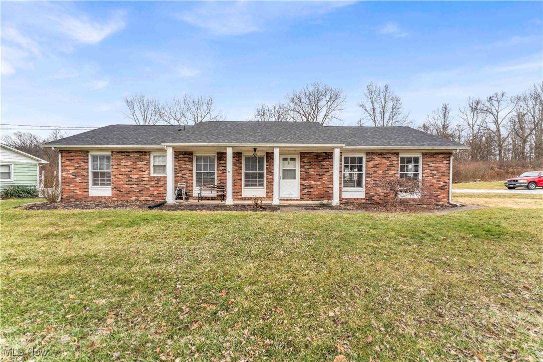14808 Darrow Road Vermilion, OH 44089 - Photo 1 of 45 Ranch-style home with covered porch and a front lawn