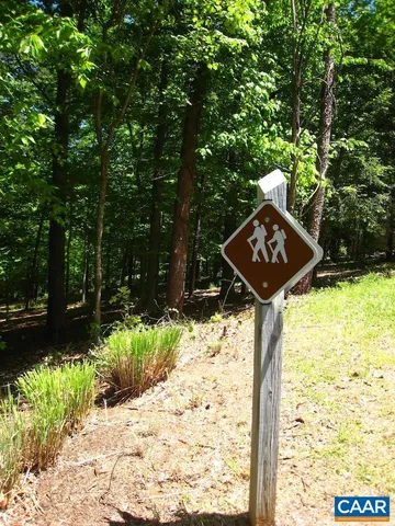 a sign board with a yard