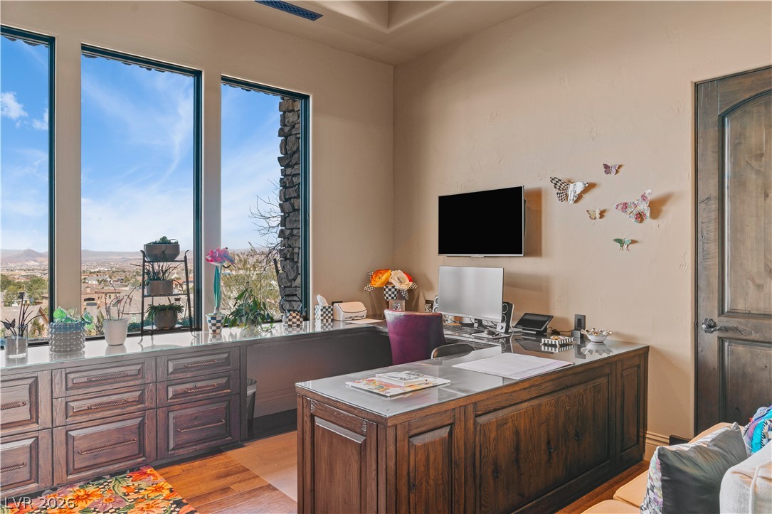 1123 Christian Road Henderson, NV 89002 - Photo 38 of 94 Custom cabinetry and large windows with scenic outdoor views define this comfortable home office.