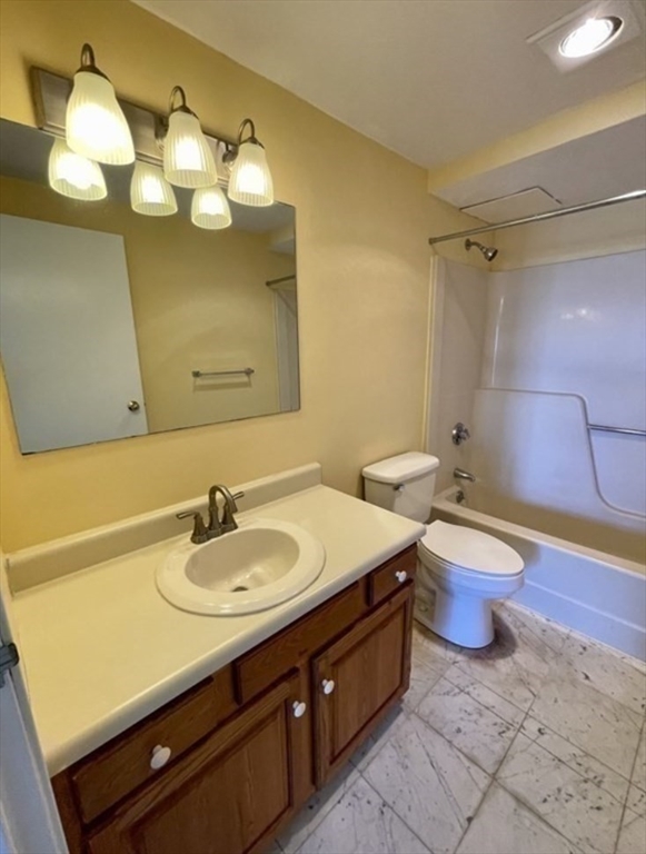 100 Cove Way, Unit 608 Quincy, MA 02169 - Photo 11 of 20 a bathroom with a double vanity sink and a mirror